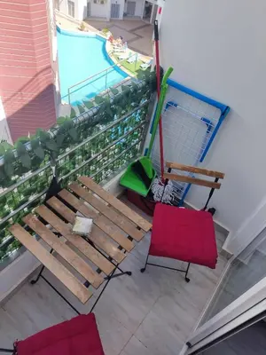 an overhead view of a bench and a pool at Aqua Palms Resort Hurghada in Hurghada