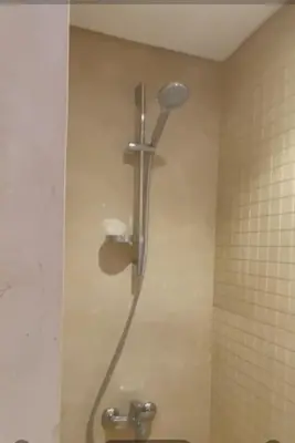 a shower stall in a bathroom with a toilet at M8 free access to the BEACH and POOL in Hurghada