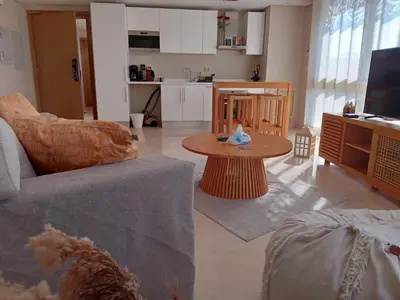 a living room with a couch and a table at M8 free access to the BEACH and POOL in Hurghada