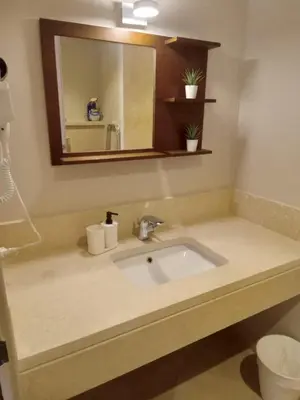 a bathroom with a sink and a mirror at M8 free access to the BEACH and POOL in Hurghada