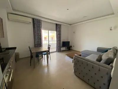 a living room with a couch and a table at Andreas Residence in Hurghada