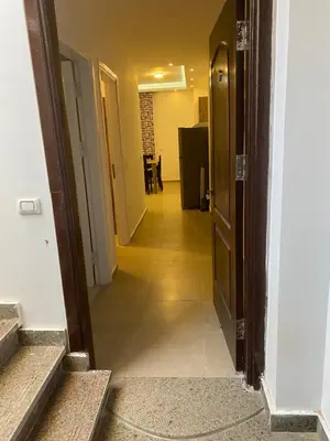 a hallway leading to a room with a hallway at Andreas Residence in Hurghada