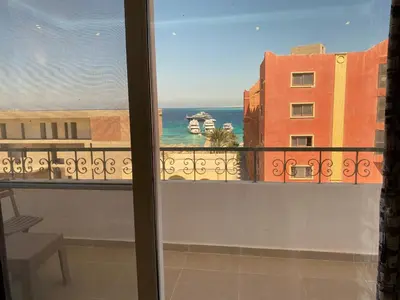 a view of the ocean from a balcony at Andreas Residence in Hurghada