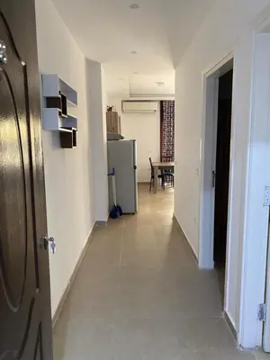 a hallway with a kitchen and a dining room at Andreas Residence in Hurghada
