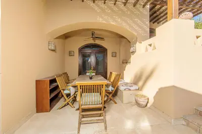 a dining room with a table and chairs at Cozy villa with private pool in Upper Nubia in Hurghada