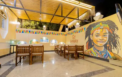 a restaurant with a large mural of a woman at Samara Guest House in Aswan