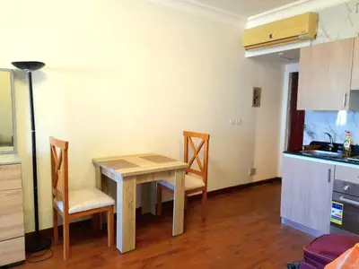 a kitchen with a table and chairs in a room at The view hurghada in Hurghada