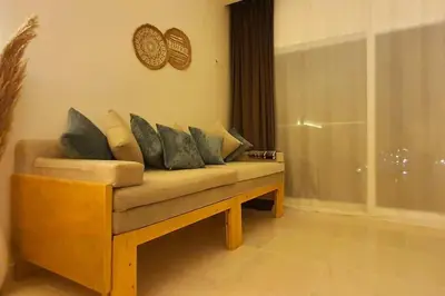 a couch with pillows on it in a living room at Studio in Selena Bay Hurghada in Hurghada