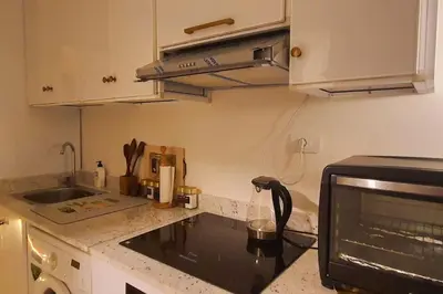 a kitchen with a sink and a microwave at Studio in Selena Bay Hurghada in Hurghada
