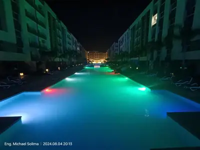 a city street lit up at night with blue lights at Fanadir sea view Appartment in Hurghada