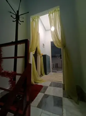 a hallway with yellow curtains in a room at Apartment Duplex Flat - Private Garden - 2 Floors in Hurghada