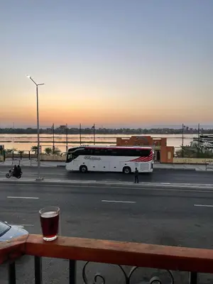a bus parked on the side of a street at Luxor Apparment in Al Bayāḑīyah