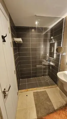 a bathroom with a shower and a sink at G Cribs Stylish Studio in Hurghada