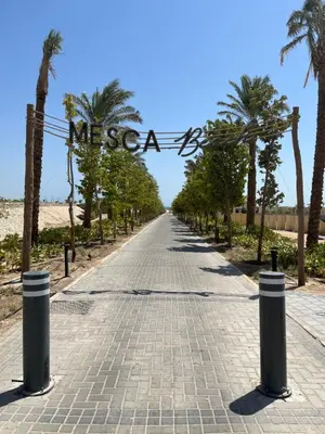 a brick road with a sign that reads mesa at Cozy 2BR Seaview loft in Mesca Somabay in Hurghada