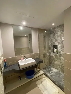 a bathroom with a sink and a shower at Gouna Luxuy Condo Hotel in El Gouna