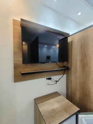 a flat screen tv on a wall in a room at جوليانا سما جروب in Hurghada