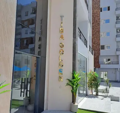 a sign on the side of a building at Tiba gollden resort in Hurghada