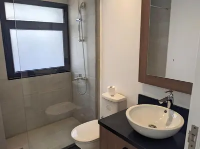 a bathroom with a sink and a toilet and a window at Sea View Studio in Soma Bay With Free Beach & Pool in Hurghada