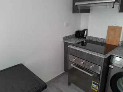 a kitchen with a stove and a counter top at Cozy Studio in Hurghada bali theme resort in Hurghada
