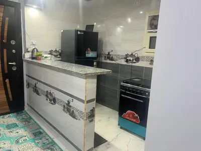 a kitchen with a counter and a stove at Dream apartment1 in Hurghada