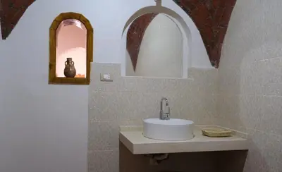 a bathroom with a sink and a mirror at Kemet House in Luxor