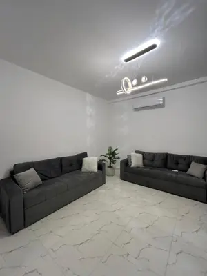 a living room with two couches and a ceiling at La Prestigia in Hurghada