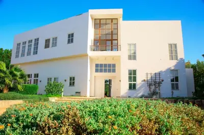 a white house with a lot of windows at White villa phase2 - Elgouna 5BD in Hurghada