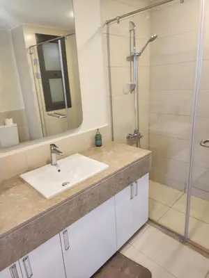a bathroom with a sink and a shower at Sunrise to Sunset Rooftop Panorama - El Gouna Shedwan in Hurghada