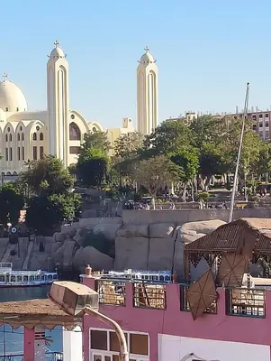 a view of a building with buildings in the background at Lale Hoste in Nag` el-Ramla