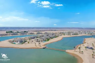 an aerial view of a resort on a beach at Tranquil 2BR in Shedwan I El Gouna I Pool and Lagoon View in Hurghada