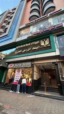 two people standing in front of a new man store at aswan view 3 bedrooms in Aswan