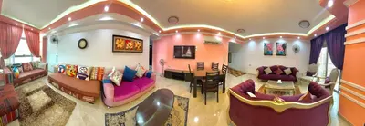 a living room with purple couches and a table at aswan view 3 bedrooms in Aswan