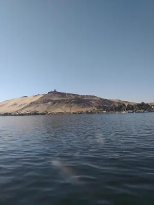 a large body of water with a mountain in the background at Mourad morsy مراد in Najâ€˜ al MadÄbb