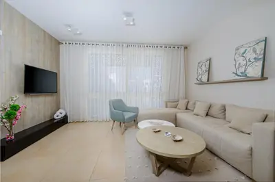 a living room with a couch and a table at Delightful Gateway in Mangroovy in Hurghada