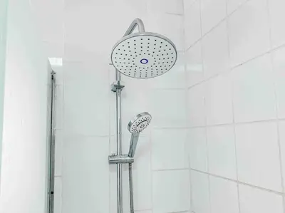 a shower with a shower head in a bathroom at Sunny Sea View Studio Marina on private roof in Hurghada
