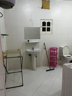 a bathroom with a sink and a toilet at Sekhmet Appartement 2 chambres in Luxor
