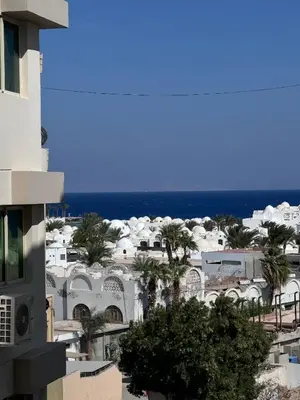 a view of the ocean from a building at Sea Light Apartment in Hurghada