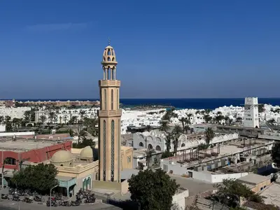 a clock tower in the middle of a city at Sea Light Apartment in Hurghada
