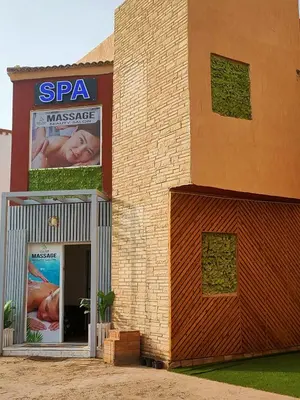 a building with a sign that reads spa massage at Lux Gardenhouse pool WiFi Private garden Hurghada in Hurghada