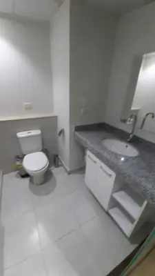 a white bathroom with a toilet and a sink at Hurghada Ägypten Scandic Resort in Hurghada