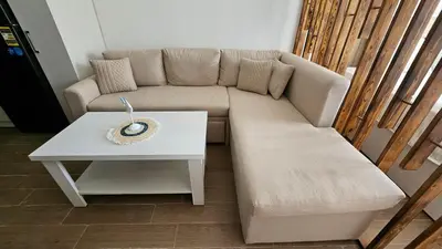 a living room with a couch and a table at Fully equipped studio Sahl Hasheesh in Hurghada