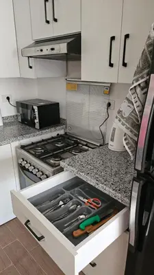 a kitchen with an open drawer in the counter top at Fully equipped studio Sahl Hasheesh in Hurghada