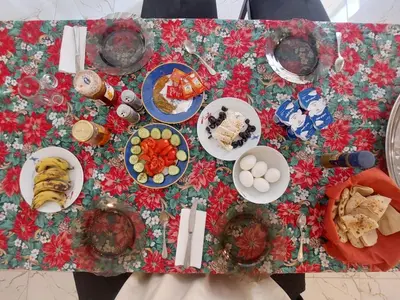 a table with plates of food on top of it at Carter Guesthouse Luxor 1 in ‘Ezbet Abu Ḥabashi