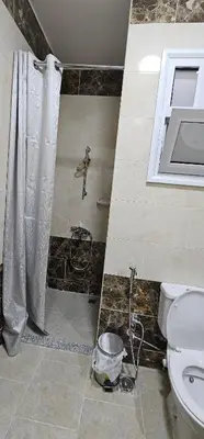 a bathroom with a shower and a toilet at Hurghada seaview apartment in Hurghada