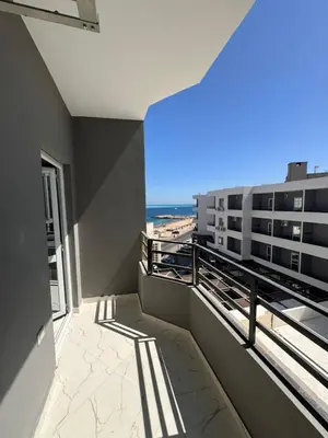a balcony with a view of the beach at Hurghada seaview apartment in Hurghada
