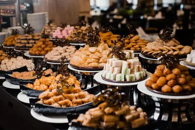 a buffet of different types of food on plates at Aladdin Beach Resort in Hurghada