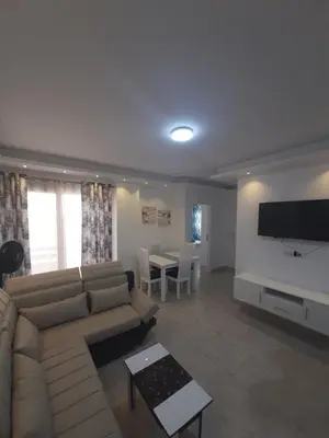 a living room with a couch and a table at SKY EL Gandoul Wohnung Hurghada in Hurghada
