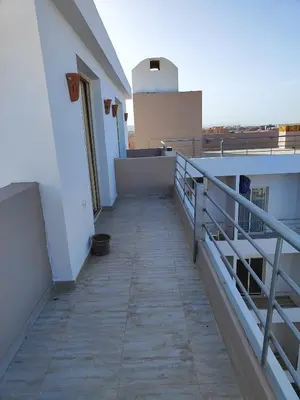 a walkway on the side of a building at Stunning Rooftop 1 Bed Apartment in Hurghada