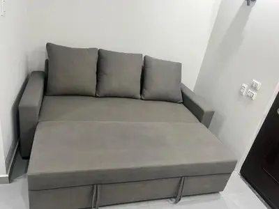 a couch sitting in a corner of a room at scandic resort in Hurghada