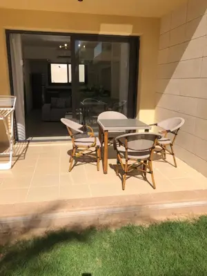 a patio with a table and chairs on a patio at G cribs B15 in Hurghada
